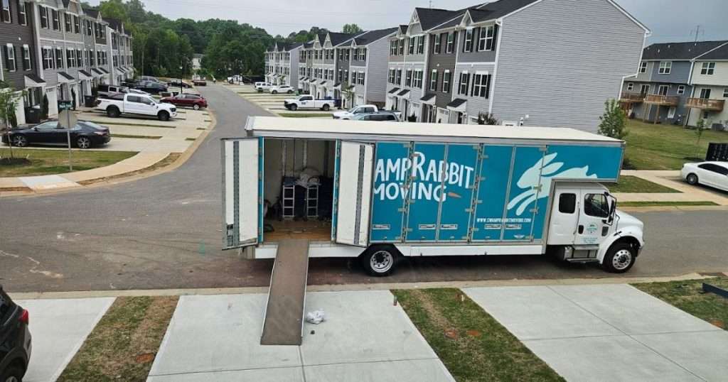 Swamp Rabbit Moving & Storage moving truck in a residential neighborhood in Greenville, South Carolina, with the ramp down