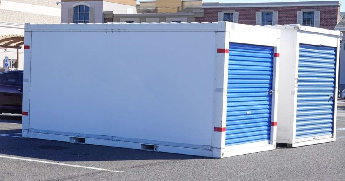 Two Greenville moving containers in a parking lot