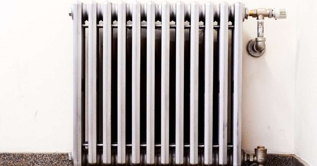 An older radiator against a neutral painted wall. Breaking a lease in South Carolina may be allowed when it's uninhabitable due to a lack of heat, electricity, or running water. 
