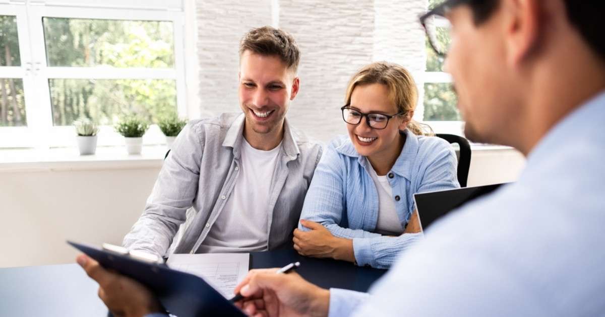 A South Carolina mortgage lender meeting with two clients