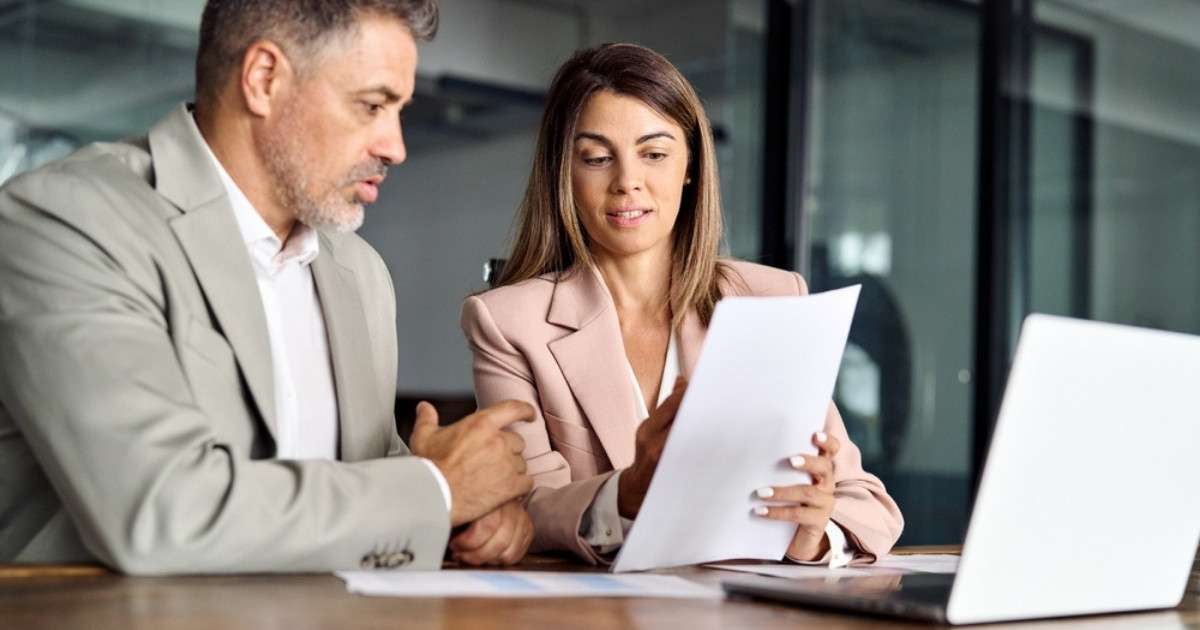 A South Carolina real estate attorney overlooking a document with her client