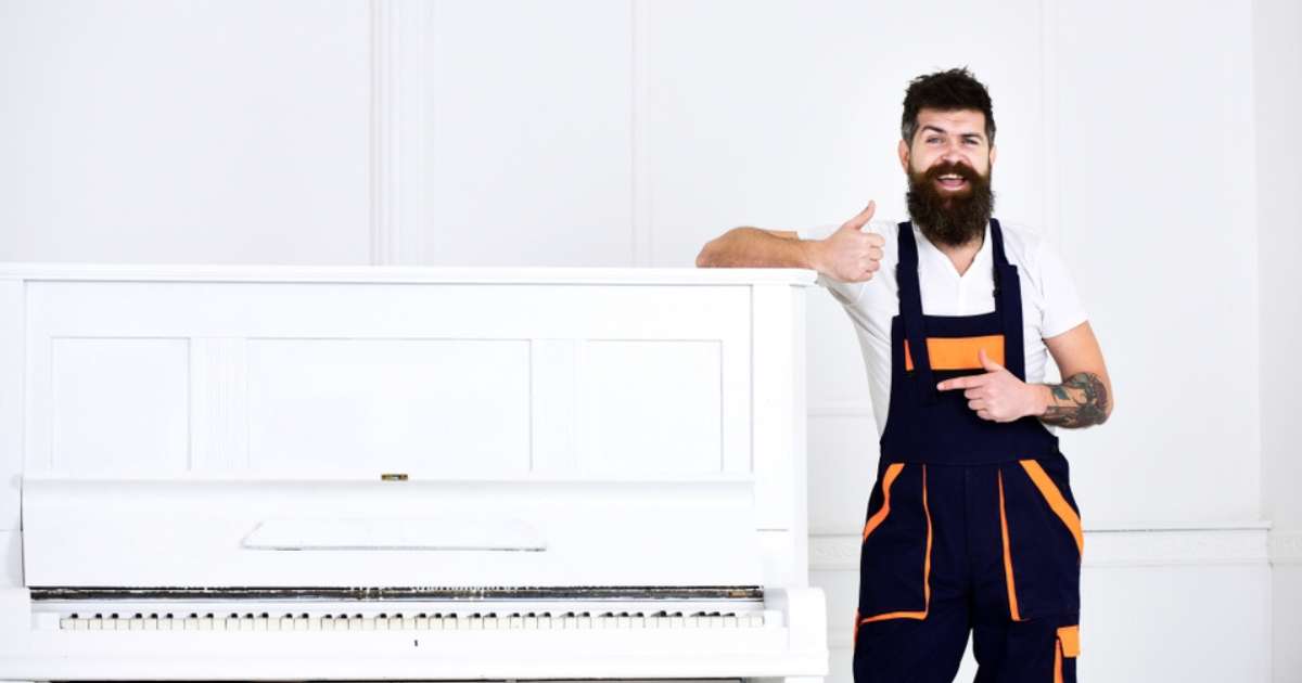 A happy piano mover during an instrument relocation.
